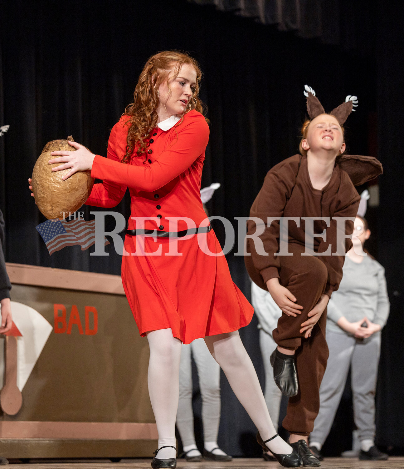 Veruca Salt played by Eve Foster snatches a nut from a squirrel played by her sister, Martie Foster, during Willy Wonka Saturday, March 23.